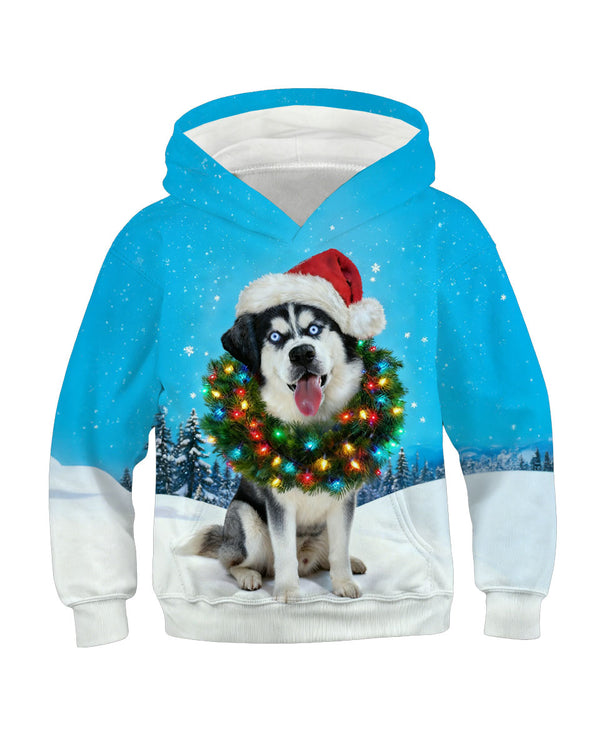 Blue hoodie with husky dog wearing Christmas wreath in snow